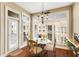 Bright breakfast nook with glass table and white shutters at 226 Mclaren Gates Dr, Marietta, GA 30060
