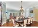 Spacious dining area with hardwood floors, fireplace, and French doors at 226 Mclaren Gates Dr, Marietta, GA 30060