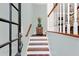 Elegant entryway with hardwood floors, staircase, and glass door at 226 Mclaren Gates Dr, Marietta, GA 30060