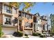 Three-story brick townhouses with balconies and attached garages at 226 Mclaren Gates Dr, Marietta, GA 30060