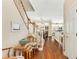 Hardwood floor hallway with staircase and view into living room at 226 Mclaren Gates Dr, Marietta, GA 30060