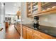 Kitchen pantry with black countertops and wooden cabinets at 226 Mclaren Gates Dr, Marietta, GA 30060