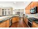 Open concept kitchen with hardwood floors and ample cabinetry at 226 Mclaren Gates Dr, Marietta, GA 30060