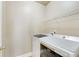 Bright laundry room complete with washer, dryer, and shelving at 226 Mclaren Gates Dr, Marietta, GA 30060
