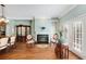 Bright living room with hardwood floors, fireplace, and built-in shelving at 226 Mclaren Gates Dr, Marietta, GA 30060