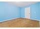 Light blue-walled bedroom with brown carpet at 4911 Crinklepoint Ct, Douglasville, GA 30134