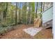 Backyard with wooden deck and patio, wooded area at 4027 Evelyn Dr, Powder Springs, GA 30127