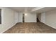 Spacious finished basement with tile flooring, separate rooms, and ample storage at 4027 Evelyn Dr, Powder Springs, GA 30127