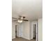 Large bedroom with ceiling fan and access to multiple closets at 4027 Evelyn Dr, Powder Springs, GA 30127