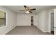 Well-lit bedroom featuring a ceiling fan and private bathroom access at 4027 Evelyn Dr, Powder Springs, GA 30127