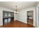 Dining room with hardwood floors and views to living room at 4027 Evelyn Dr, Powder Springs, GA 30127