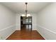 Hardwood floor dining room with chandelier and chair rail at 4027 Evelyn Dr, Powder Springs, GA 30127