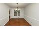 Bright dining room with hardwood floors and chandelier at 4027 Evelyn Dr, Powder Springs, GA 30127