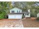 Ranch home with three-car garage and mature trees at 4027 Evelyn Dr, Powder Springs, GA 30127