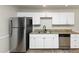 Kitchen features granite countertops, stainless steel appliances, and white cabinets at 4027 Evelyn Dr, Powder Springs, GA 30127