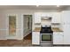 Kitchen with stainless steel appliances, granite countertops, and access to a deck at 4027 Evelyn Dr, Powder Springs, GA 30127