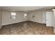 Living room with tile floors and plenty of natural light at 4027 Evelyn Dr, Powder Springs, GA 30127