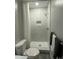 Small bathroom with a toilet and a marble shower at 3759 Stanford Cir, Decatur, GA 30034