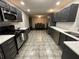 Modern kitchen with dark cabinets and stainless steel appliances at 3759 Stanford Cir, Decatur, GA 30034
