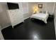 Bedroom with dark hardwood floors, white dresser, and a double bed at 3759 Stanford Cir, Decatur, GA 30034