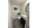 Updated bathroom with a tub, shower, and dark tile floors at 3759 Stanford Cir, Decatur, GA 30034