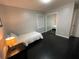 Bedroom with dark hardwood floors and a twin bed at 3759 Stanford Cir, Decatur, GA 30034
