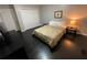 Bedroom with dark floors and double doors to closet at 3759 Stanford Cir, Decatur, GA 30034