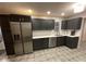 Modern kitchen with dark cabinets and stainless steel appliances at 3759 Stanford Cir, Decatur, GA 30034