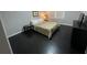 Spacious bedroom with dark floors and a queen-size bed at 3759 Stanford Cir, Decatur, GA 30034