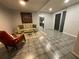 Living room with tiled floors, a couch and an armchair at 3759 Stanford Cir, Decatur, GA 30034