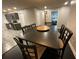 Dark wood dining table with six chairs, kitchen view at 3759 Stanford Cir, Decatur, GA 30034