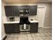 Modern kitchen with stainless steel appliances and gray cabinets at 3759 Stanford Cir, Decatur, GA 30034