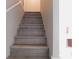 Modern gray stairs leading to the upper level of the home at 99 Libby Ln, Jonesboro, GA 30238