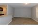Living room with grey walls, wood-look flooring, and door at 99 Libby Ln, Jonesboro, GA 30238