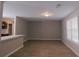 Dining room with grey walls, wood-look flooring, and kitchen view at 99 Libby Ln, Jonesboro, GA 30238