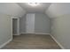 Spacious bonus room with gray walls and wood-look flooring at 99 Libby Ln, Jonesboro, GA 30238