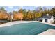 Community swimming pool with a safety cover and nearby playground at 790 Riverwood Pass, Dallas, GA 30157