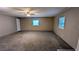 Large living room with ceiling fan and carpet at 5453 Deerfield Trl, Atlanta, GA 30349