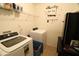 Laundry room with washer, dryer, and shelving at 4755 Stonecrop Dr, South Fulton, GA 30349