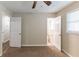 Bedroom with two doors, carpet, and access to bathroom at 160 Cross Creek Pkwy, Dallas, GA 30157
