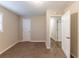 Well-lit bedroom with carpet, closet and access to hallway at 160 Cross Creek Pkwy, Dallas, GA 30157