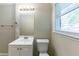 Clean bathroom with vanity, toilet and window at 160 Cross Creek Pkwy, Dallas, GA 30157