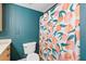 Bathroom with teal walls, peach shower curtain, and updated toilet at 387 Ralph Mcgill Ne Blvd # K, Atlanta, GA 30312