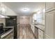 Eat-in kitchen boasting granite countertops and stainless steel appliances at 3730 Douglas Ridge Trl, Douglasville, GA 30135