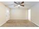 Bright living room featuring neutral walls and carpet at 3730 Douglas Ridge Trl, Douglasville, GA 30135