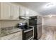 Modern kitchen featuring stainless steel appliances and granite countertops at 3730 Douglas Ridge Trl, Douglasville, GA 30135