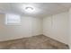 Finished basement room with neutral walls and carpet at 3730 Douglas Ridge Trl, Douglasville, GA 30135
