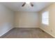 Spacious bedroom with neutral carpeting and large window at 3730 Douglas Ridge Trl, Douglasville, GA 30135