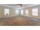 Large living room with wall-to-wall carpeting and ceiling fan at 3730 Douglas Ridge Trl, Douglasville, GA 30135