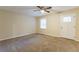 Living room featuring neutral carpeting and a ceiling fan at 3730 Douglas Ridge Trl, Douglasville, GA 30135